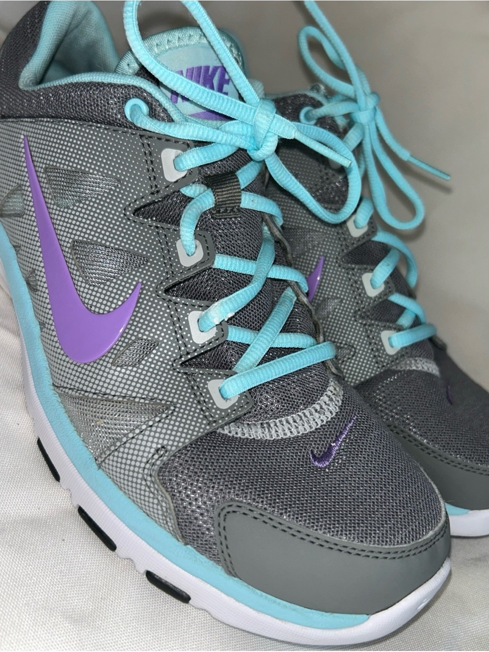 Nike Gray Sneakers with Purple Swoosh and Aqua Laces